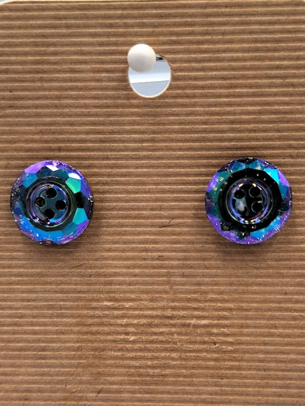 Round, iridescent stud earrings